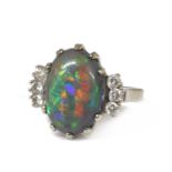An American white gold black opal and diamond ring,