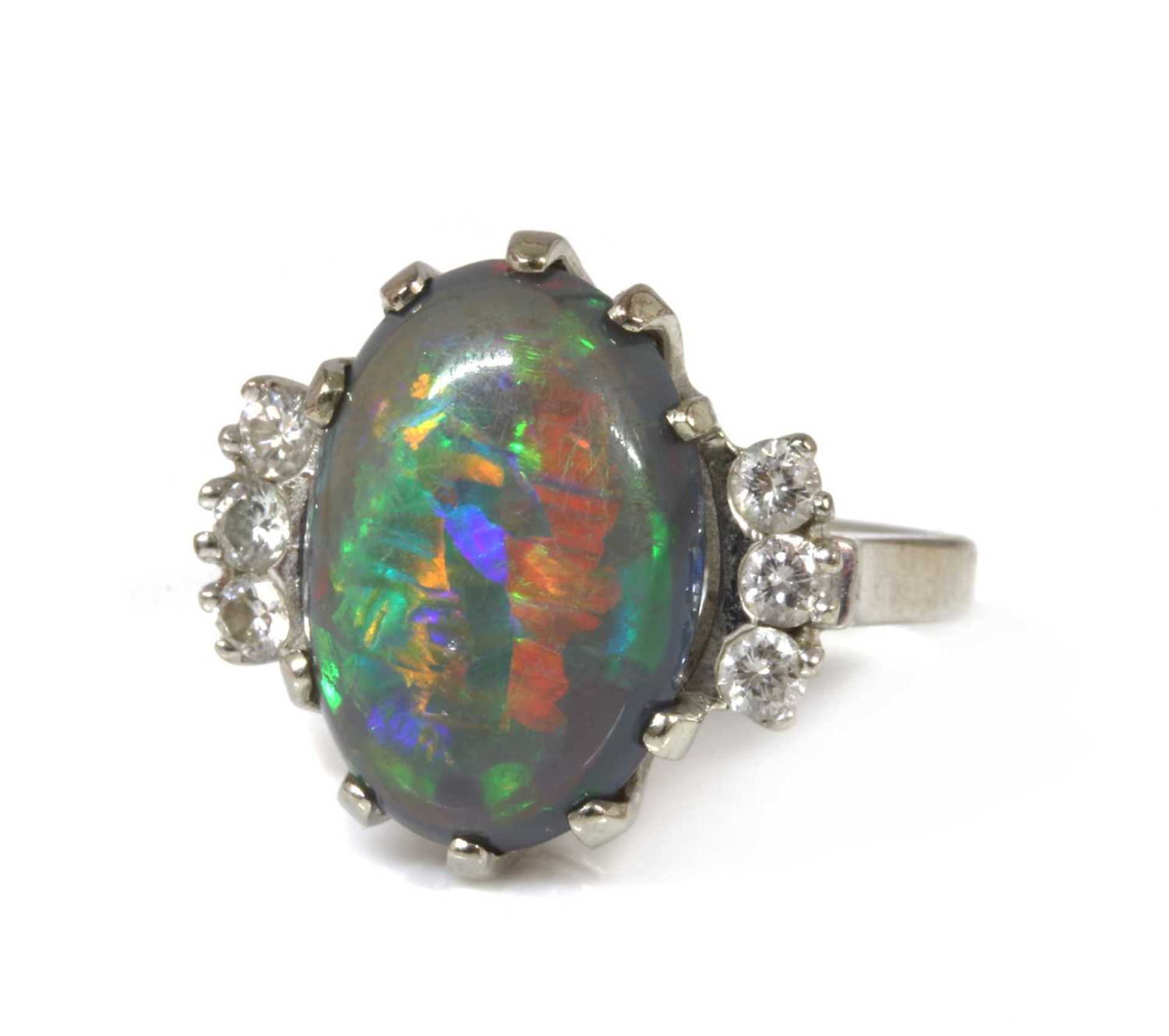 An American white gold black opal and diamond ring,