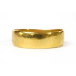 A 22ct gold flat section wedding ring,