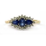 A 9ct gold sapphire and diamond three stone cluster ring,