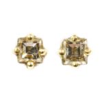 A pair of single stone diamond earrings,