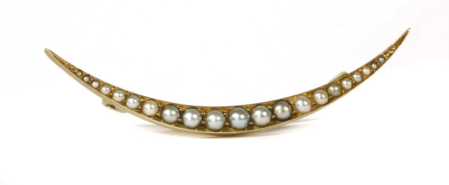 An Edwardian gold split pearl open crescent brooch,