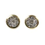 A pair of gold diamond cluster earrings,