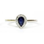 A white gold sapphire and diamond cluster ring,