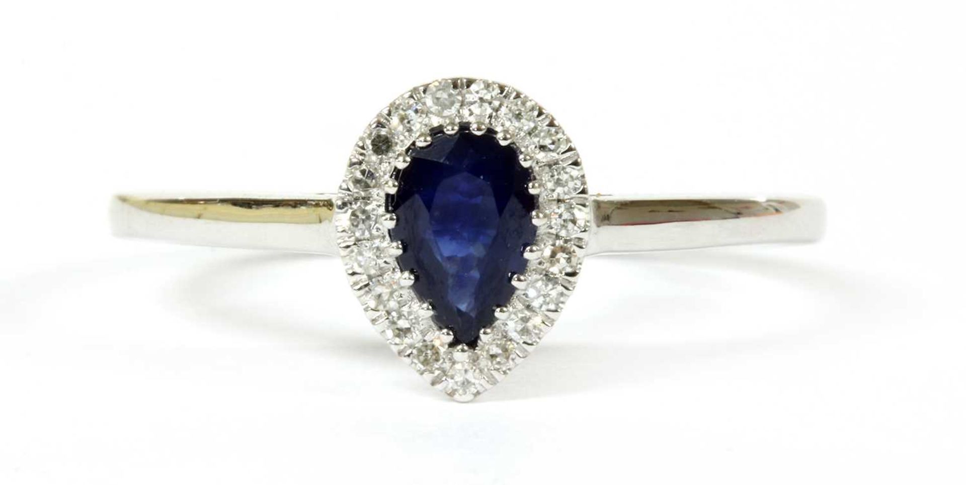 A white gold sapphire and diamond cluster ring,