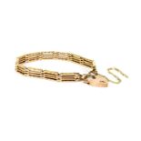 A gold four row gate bracelet,