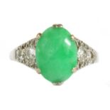 A white gold jade and diamond ring,