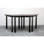 A set of three contemporary triangular tables,