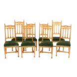 A set of eight Arts and Crafts oak dining chairs,
