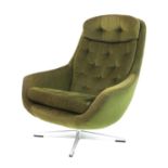 A green corduroy lounge chair,