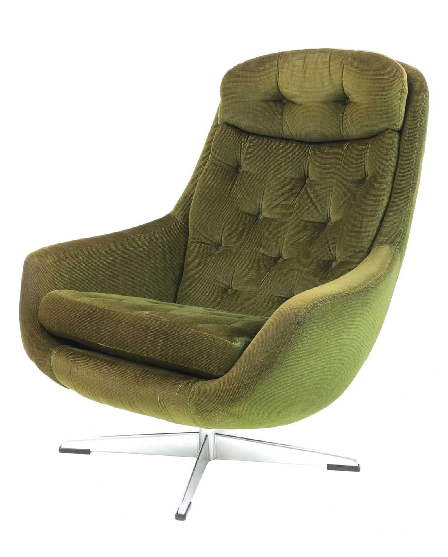 A green corduroy lounge chair,