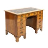 An Arts and Crafts walnut desk,