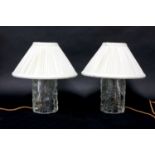 A pair of heavy glass table lamp bases,