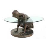 A contemporary bronze and glass 'She'll Find' coffee table,