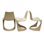 Three Cado moulded plastic stacking chairs,