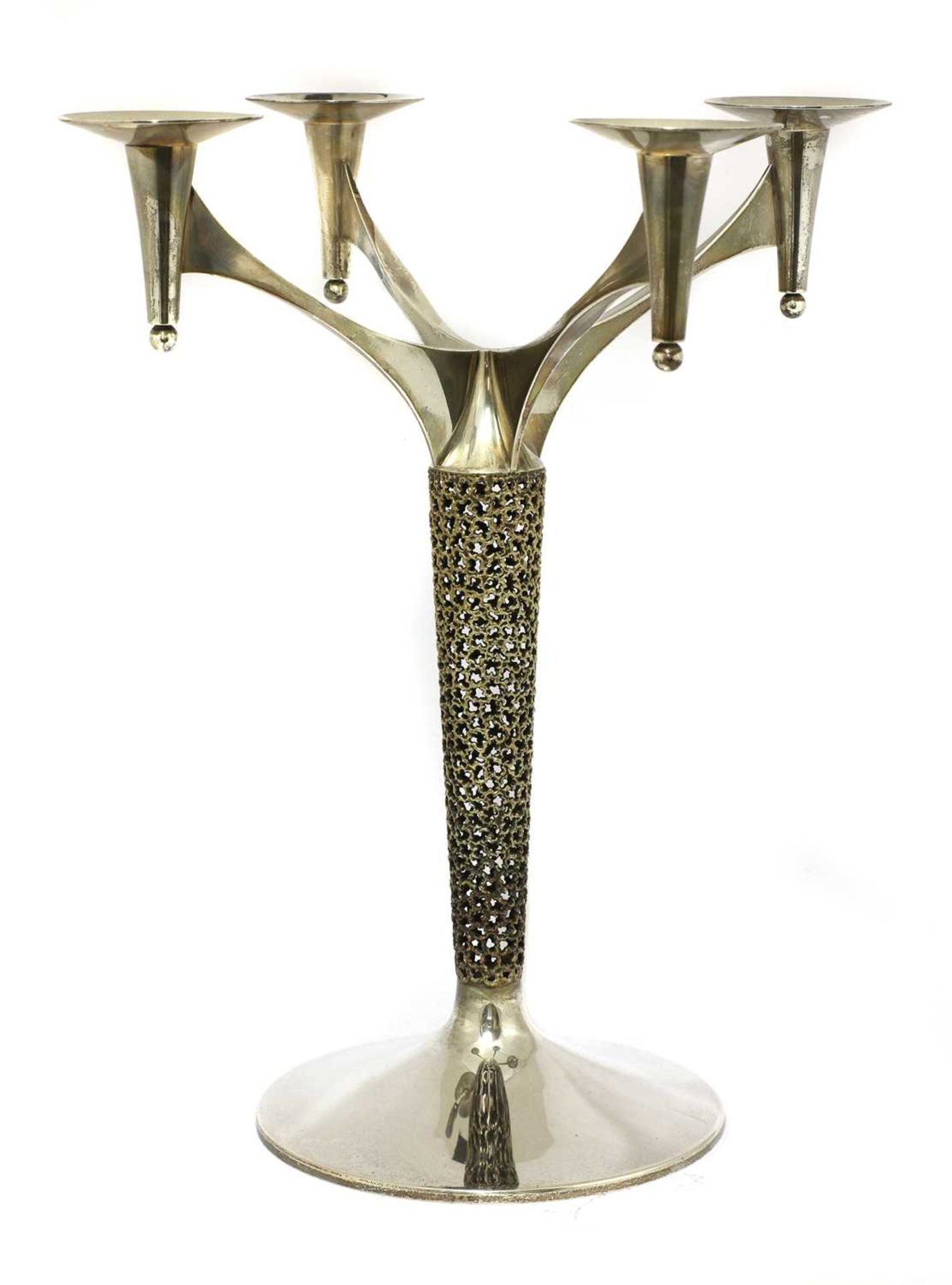 A silver-gilt four branch candelabra,