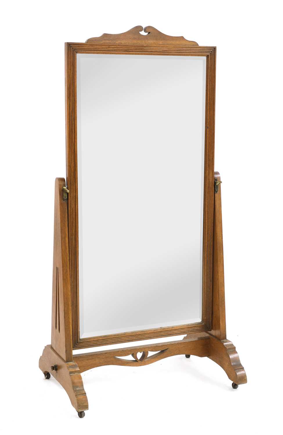 An Arts and Crafts oak cheval mirror,