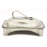 An Arts and Crafts pewter muffin dish and cover,