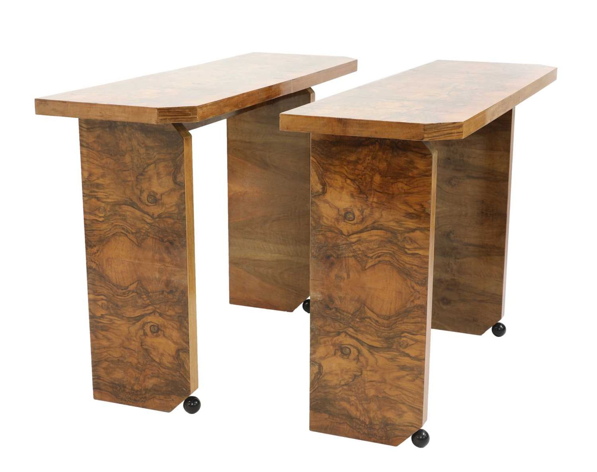 A pair of Art Deco burr walnut-style console tables,