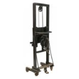 An industrial cast iron easel,