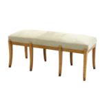 An Art Deco-style maple duet stool,