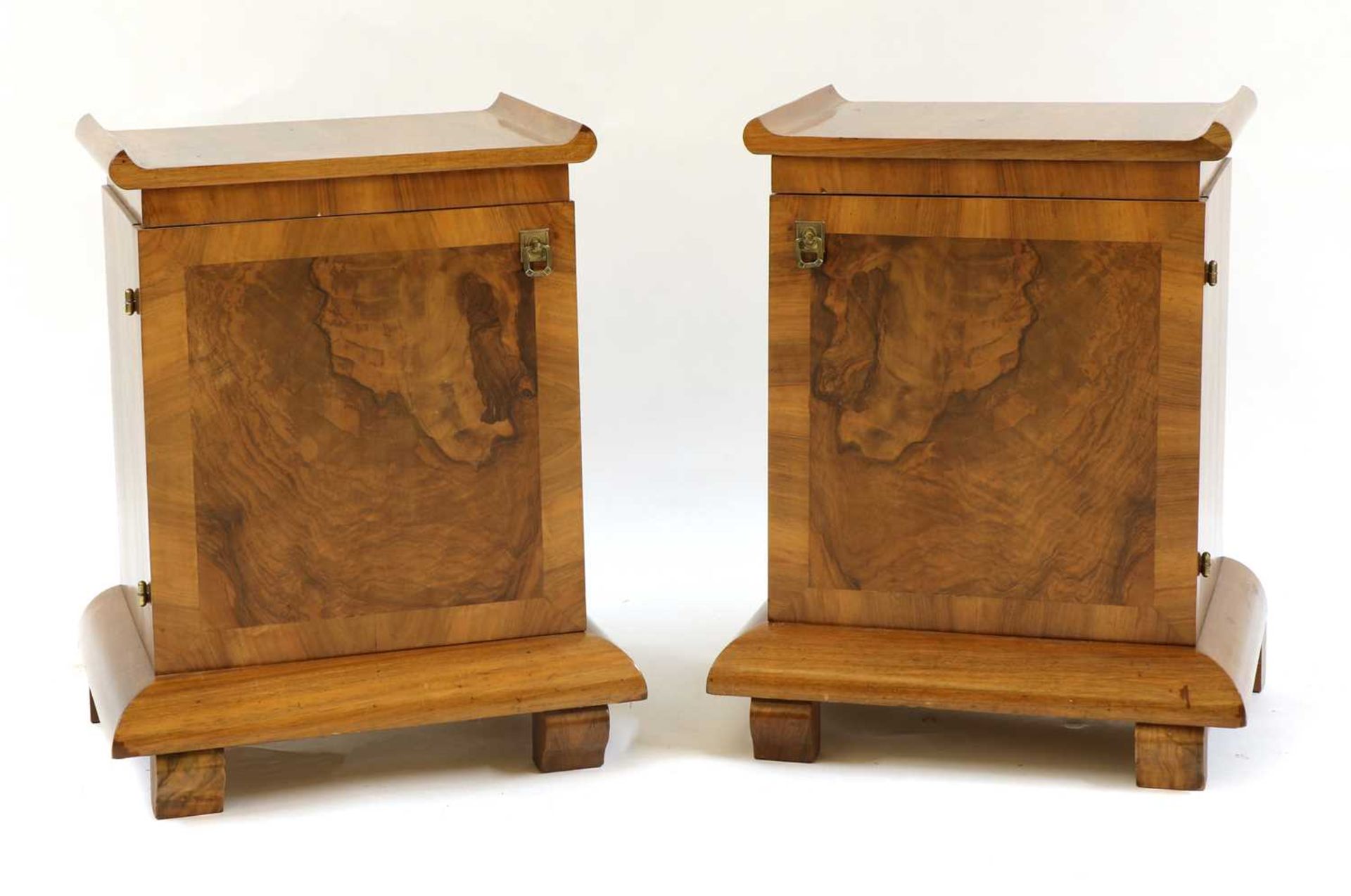 A pair of Art Deco walnut bedside cupboards,