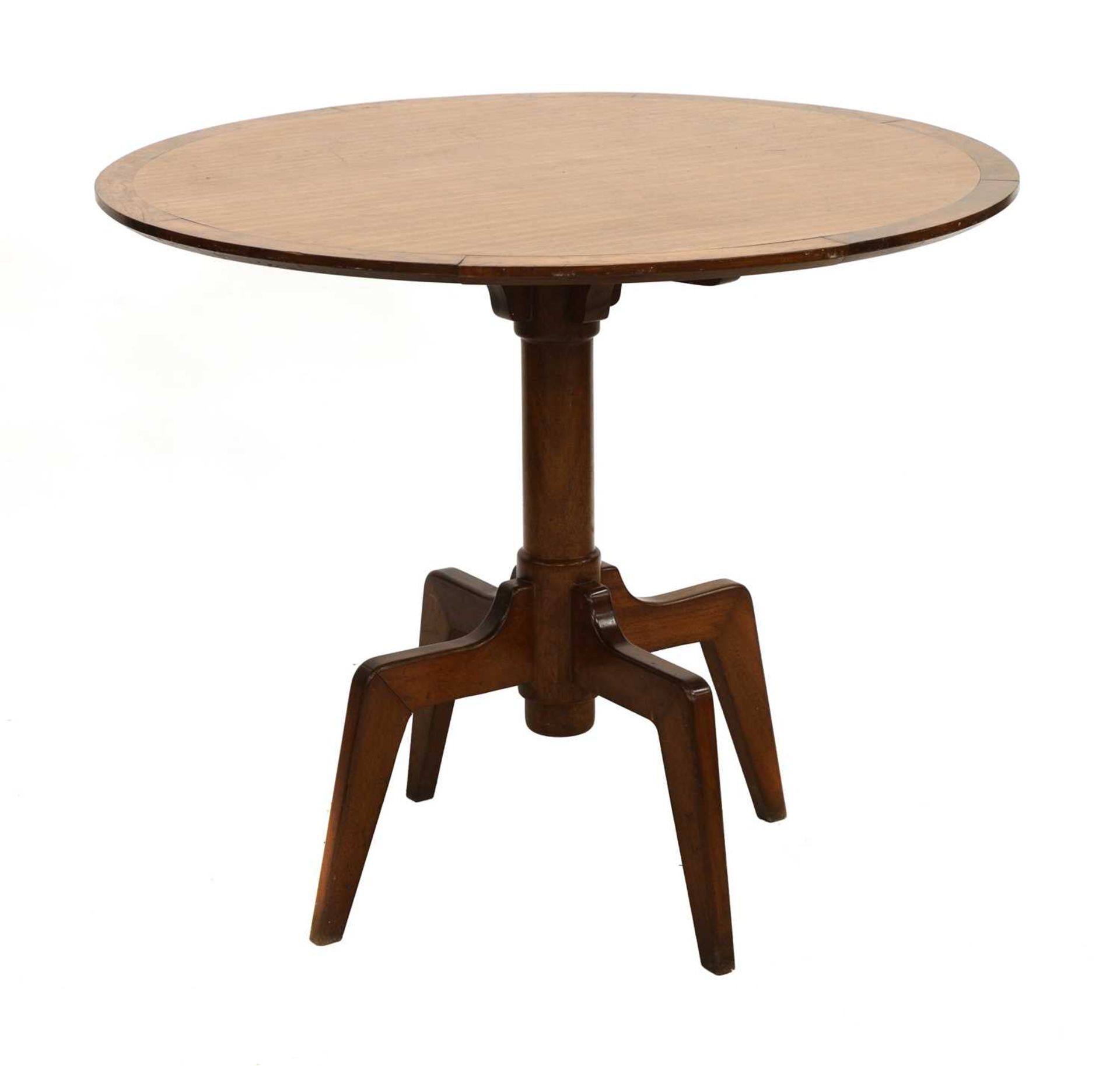 A teak and yew wood centre table,