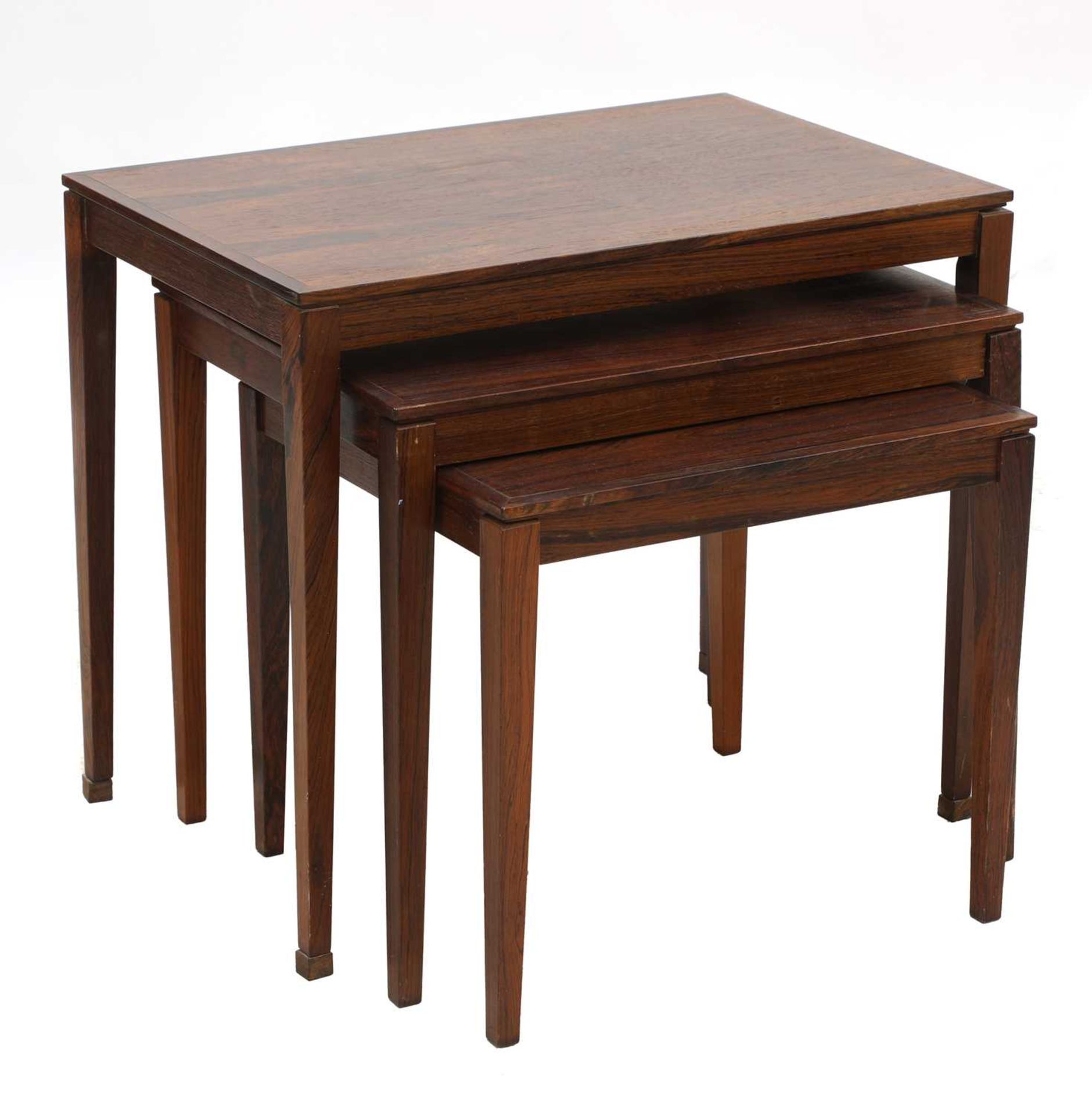 A Danish rosewood nest of three tables, §