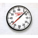 A Speedo pace wall clock,