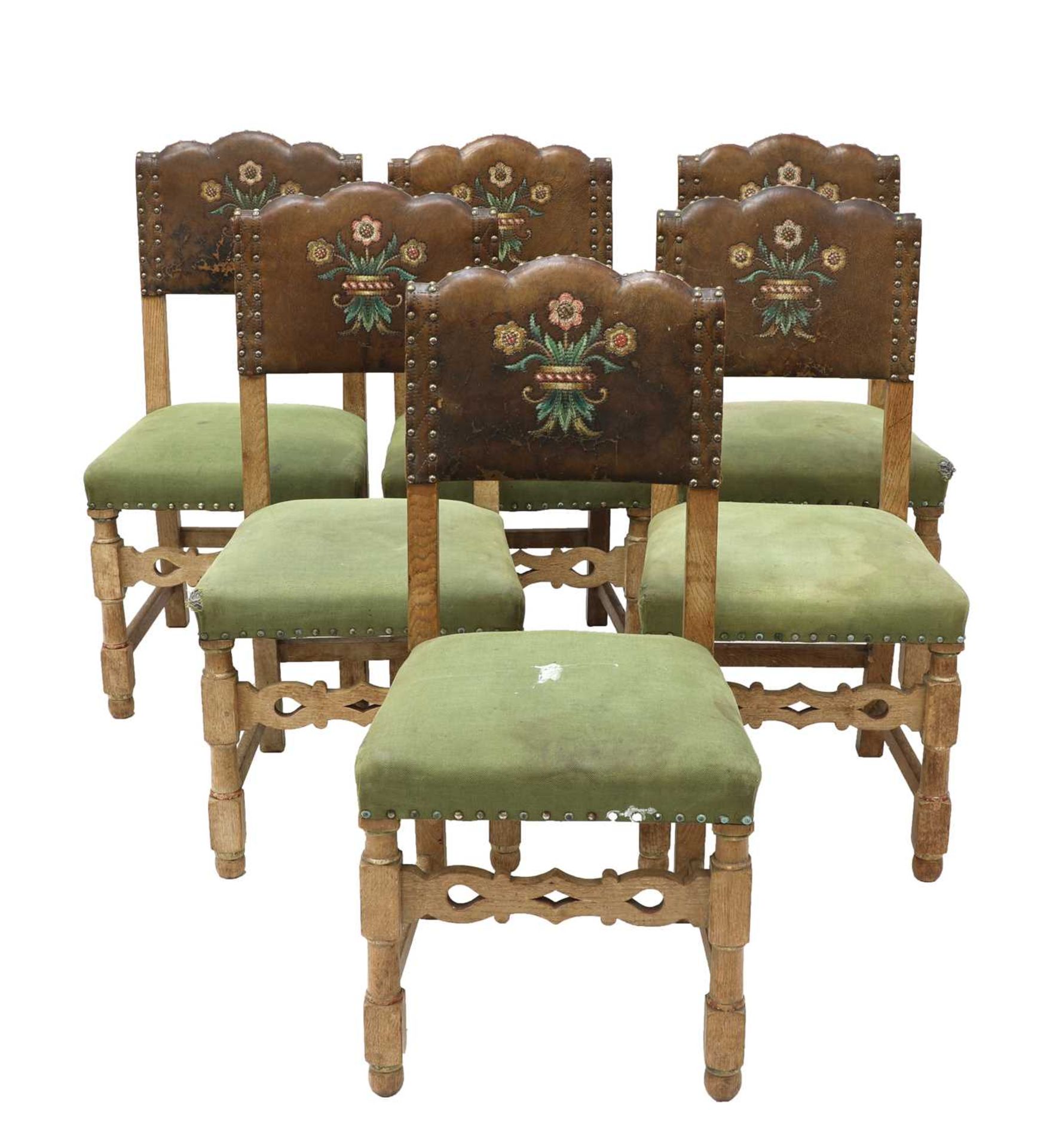 A set of six limed oak dining chairs,