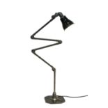 A British Invisaflex articulated four-section desk lamp,