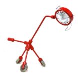 A contemporary red desk lamp,