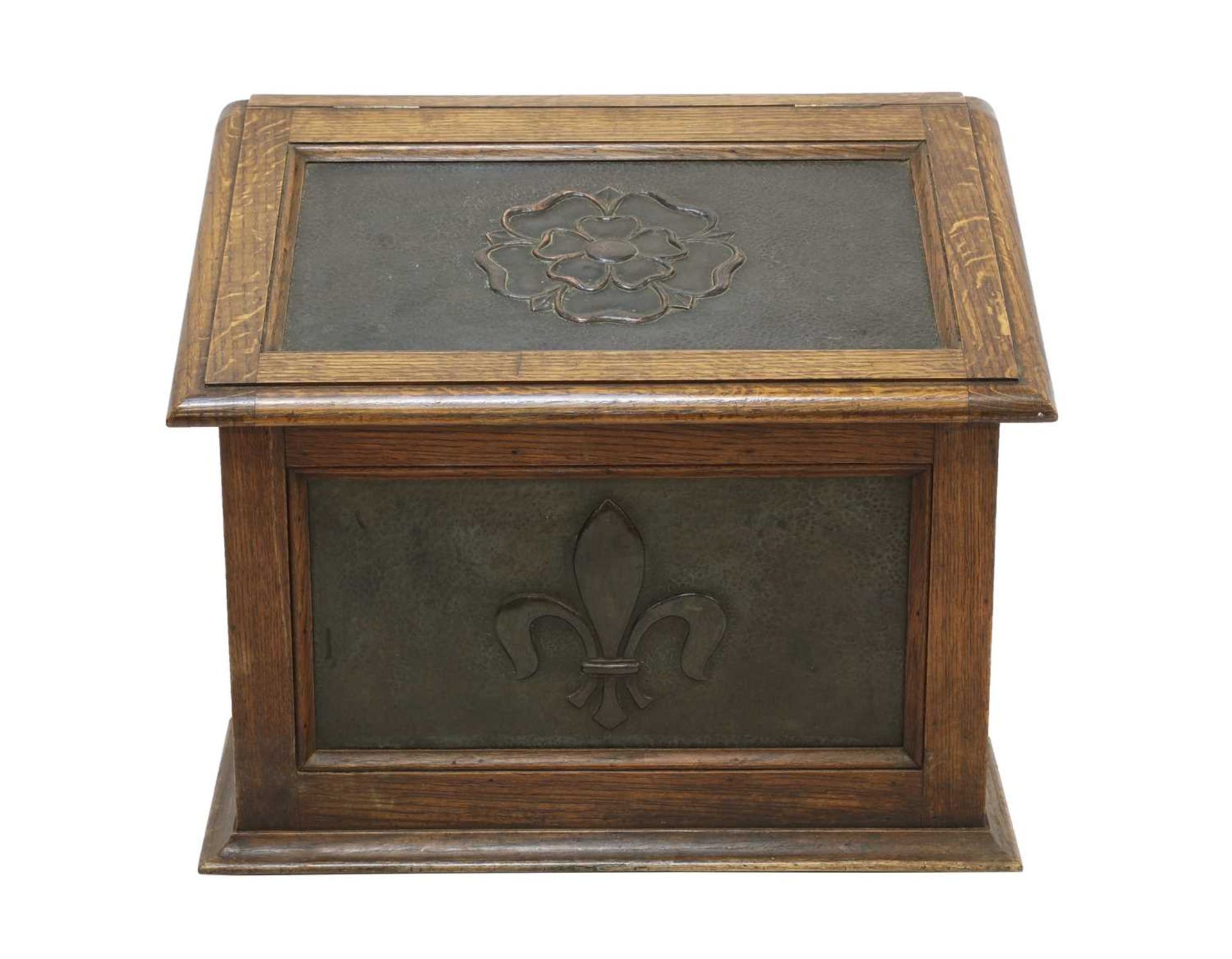 An Arts and Crafts oak and copper-mounted log bin,