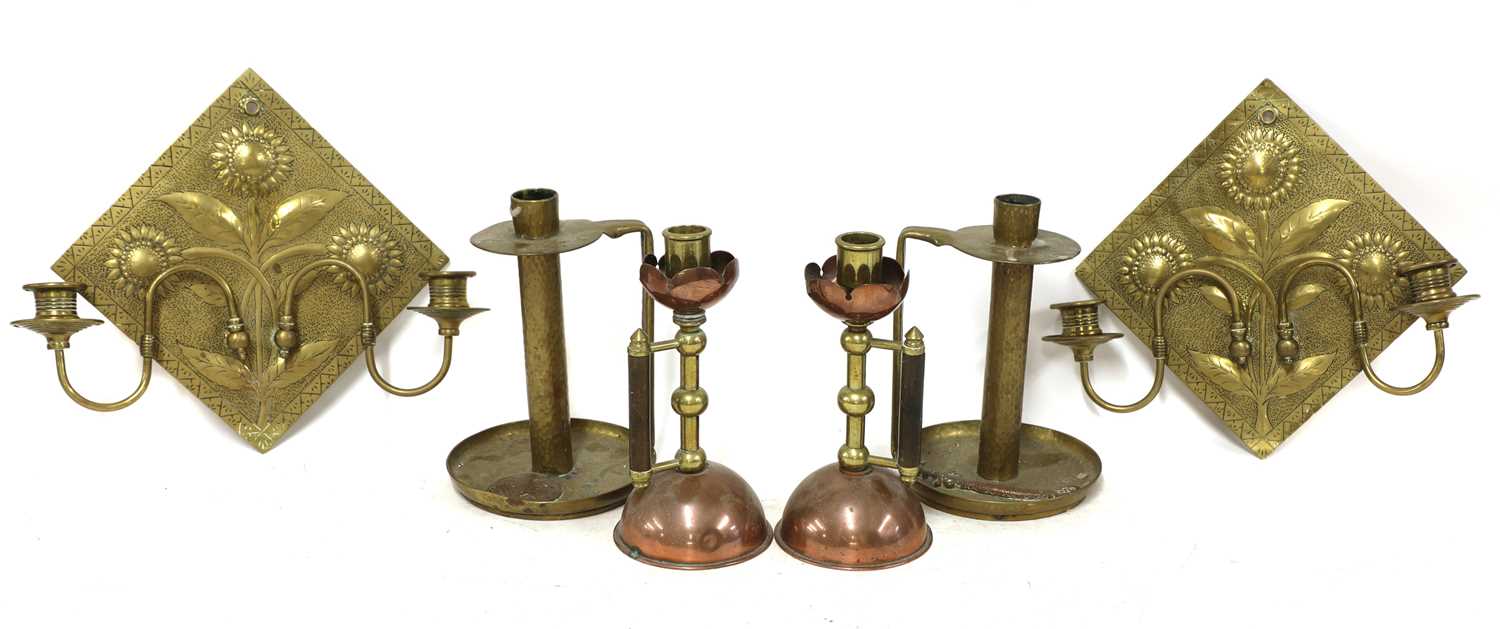 A pair of Aesthetic engraved brass wall lights,