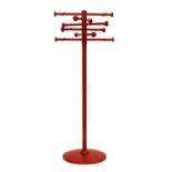 A red painted wood coat stand,