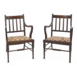 A pair of walnut armchairs,