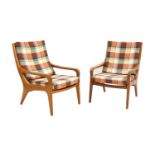 A pair of teak armchairs,