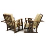 A pair of Art Deco oak reclining armchairs,