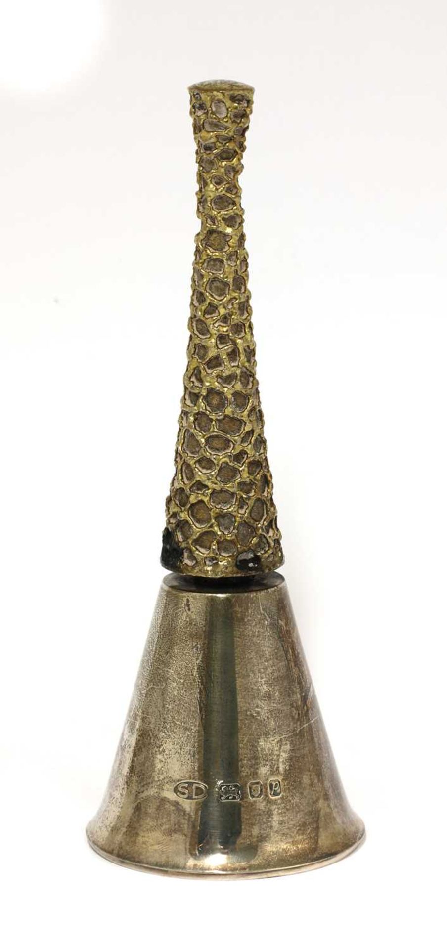 A silver gilt table bell,