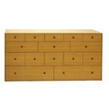 A contemporary oak veneered chest of drawers,