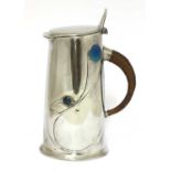 A Liberty Tudric pewter and enamel jug,