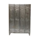 A set of four metal lockers,