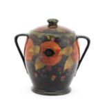 A William Moorcroft 'Pomegranate' biscuit barrel and cover,