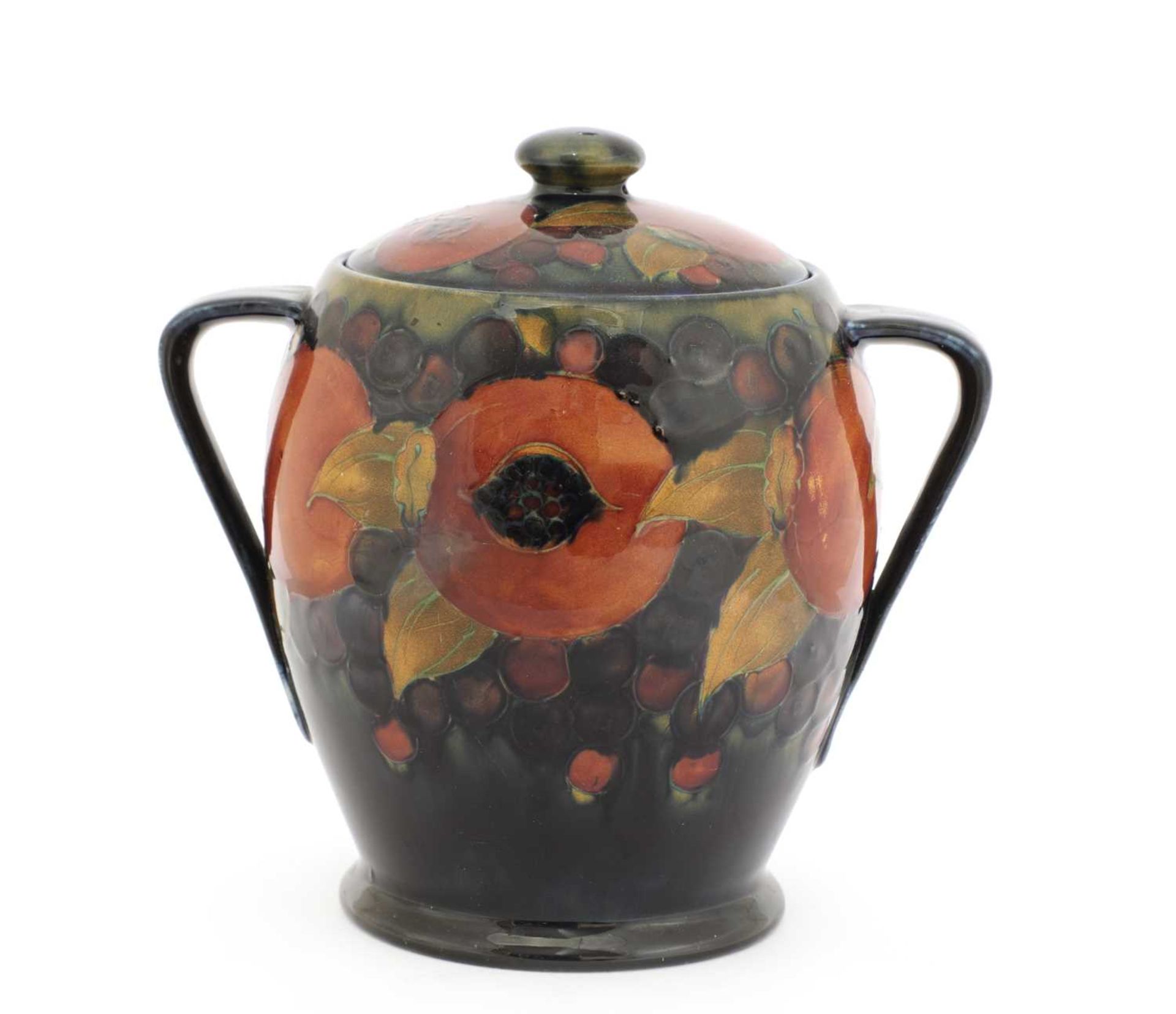 A William Moorcroft 'Pomegranate' biscuit barrel and cover,