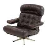 A chocolate leather lounger,