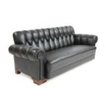 A Danish black leather settee,