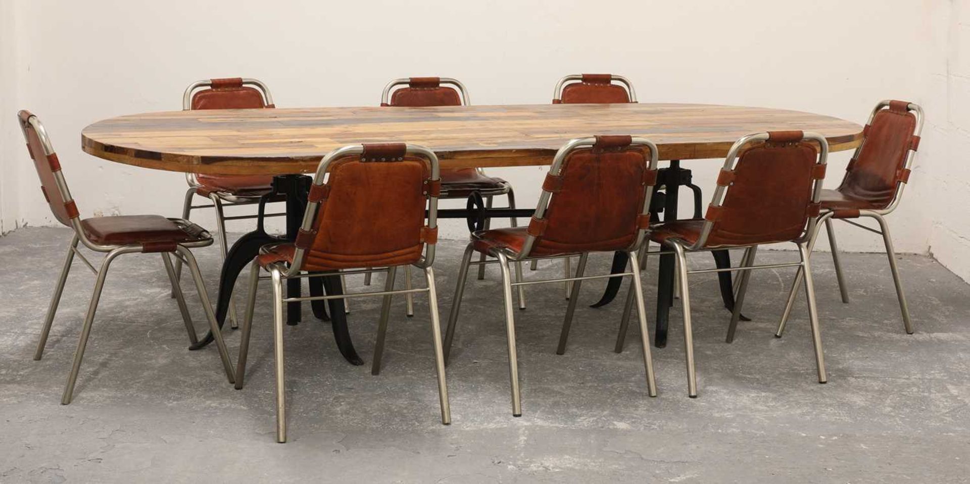 A set of eight contemporary leather slung dining chairs,