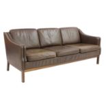 A Danish brown leather three-seater sofa,