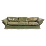 A green leather settee,