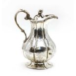 An early Victorian silver hot water jug